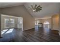 Open-concept living room showcasing wood floors, modern fan and ample natural light at 3640 Autumn View Nw Dr, Acworth, GA 30101