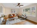 Living room features hardwood floors, a large window, and a cozy seating area at 491 Monument Se Ave, Atlanta, GA 30316