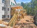 Expansive backyard featuring a wooden deck with stairs, perfect for outdoor entertaining at 4267 Matisse Ln, Fairburn, GA 30213