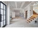 Unfinished interior with open floor plan, showing an entryway and staircase at 4267 Matisse Ln, Fairburn, GA 30213