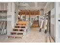 Unfinished interior view of the home's main living area with an open staircase at 4267 Matisse Ln, Fairburn, GA 30213