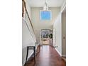 Two-story foyer with hardwood floors and glass-top console table at 2669 Glenrose Hl, Atlanta, GA 30341