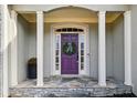 Purple front door with a wreath, flanked by columns at 2669 Glenrose Hl, Atlanta, GA 30341