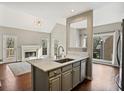 Open kitchen island, marble countertops, and view to the breakfast area at 2669 Glenrose Hl, Atlanta, GA 30341
