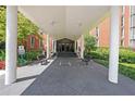 Building entrance with covered walkway, benches, and access to the building's interior at 3060 Pharr Court North Nw # 109, Atlanta, GA 30305