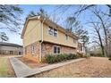 Side view of a two-story house with walkway at 4745 Elam Forest Dr, Stone Mountain, GA 30083