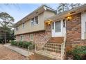 Front entrance of a two-story house with stairs at 4745 Elam Forest Dr, Stone Mountain, GA 30083