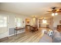 Living room with hardwood floors, neutral colors, and comfy seating at 105 Tranquillity Dr, Villa Rica, GA 30180