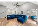 Open concept living room with hardwood floors and a view of the kitchen at 113 Willow Hill Ln, Stockbridge, GA 30281