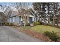 Blue craftsman home with a spacious yard and driveway at 1752 Ridgeway Nw Ave, Atlanta, GA 30318