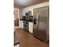 Modern kitchen with stainless steel appliances and dark countertops at 103 Live Oak Ct, Dallas, GA 30157