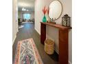 Bright entryway with console table and rug at 1334 Rogers Landing Rd, Lithonia, GA 30058