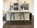 Kitchen island with granite countertop and seating at 1334 Rogers Landing Rd, Lithonia, GA 30058