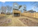 Elevated deck overlooks a grassy backyard with a wooden fence at 550 Paines Nw Ave, Atlanta, GA 30318