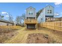 Elevated deck overlooks a grassy backyard with a wooden fence at 550 Paines Nw Ave, Atlanta, GA 30318