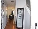 Bright entryway with hardwood floors and mirror at 532 Oakside Pl, Acworth, GA 30102