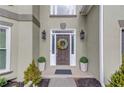 Close-up of the home's front door, showing the architectural details and complementary landscaping at 1692 Branch Creek Cv, Lawrenceville, GA 30043