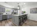 Modern kitchen with gray cabinets, island, and stainless steel appliances at 1669 Liberty Vly, Decatur, GA 30032