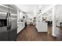 Modern kitchen with stainless steel appliances, an island with a quartz countertop, and hardwood floors at 2277 Cloverdale Se Dr, Atlanta, GA 30316