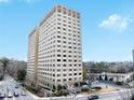 Exterior view of a tall, light beige apartment building at 2479 Peachtree Ne Rd # 802, Atlanta, GA 30305