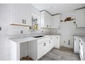 Renovated kitchen with white shaker cabinets and quartz countertops at 3845 Springleaf Ct, Stone Mountain, GA 30083