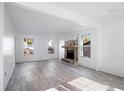 Spacious living room with stone fireplace and gray vinyl flooring at 3845 Springleaf Ct, Stone Mountain, GA 30083