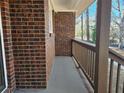 Covered front porch with brick columns and railing at 6242 Prestley Mill Rd, Douglasville, GA 30134