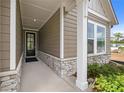 Welcoming covered entry with stone accents, leading to a modern home at 2012 Ripple Park Bnd, Canton, GA 30114