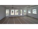 Spacious living room with natural light and modern ceiling fan at 2012 Ripple Park Bnd, Canton, GA 30114