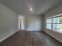 Bright living room with hardwood floors and large windows at 1421 Stephens View Dr, Loganville, GA 30052