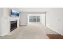 Spacious living room with fireplace and large windows at 2776 Vinings Central Se Dr # 19, Atlanta, GA 30339