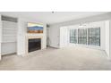 Bright living room featuring a fireplace and built-in shelving at 2776 Vinings Central Se Dr # 19, Atlanta, GA 30339