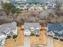 Aerial view of a house in a residential neighborhood at 1690 Geranium Ln, Cumming, GA 30040