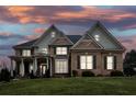 Brick house exterior at dusk, showcasing architectural details at 2057 Chambord Way, Snellville, GA 30078