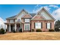 Two-story home with a brick and siding exterior at 2057 Chambord Way, Snellville, GA 30078