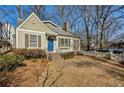 Craftsman style home with blue door and fenced yard at 2590 Knox Ne St, Atlanta, GA 30317