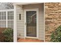 Front door entrance with stone and column accents at 1003 Somerton Pl, Cumming, GA 30040