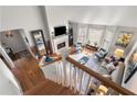 Upstairs view of living room with hardwood floors and fireplace at 1418 Defoors Nw Dr, Atlanta, GA 30318