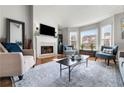 Bright living room featuring a fireplace and ample natural light at 1418 Defoors Nw Dr, Atlanta, GA 30318