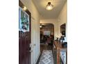 Inviting entryway with console table and view to living area at 1887 Plainsboro Dr, Lithonia, GA 30058