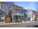 Two-story home with light gray siding, balcony, and two-car garage at 393 Summerhour St, Marietta, GA 30060