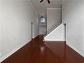 Spacious living room featuring hardwood floors and a grand staircase at 1206 Persimmon Way, Mcdonough, GA 30252