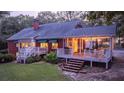 Home with deck, stairs, and patio at 992 Pj East Rd, Covington, GA 30014