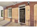Charming front door of this brick home featuring a well-manicured lawn and welcoming entrance at 340 Town Center Ave # 215, Suwanee, GA 30024