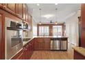 Modern kitchen with stainless steel appliances and granite countertops at 340 Town Center Ave # 215, Suwanee, GA 30024