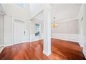 Formal dining room with hardwood floors and a chandelier at 1158 Mitford Ln, Dacula, GA 30019