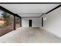 Covered patio with concrete flooring and white brick walls at 3534 Spring Cir, Decatur, GA 30032