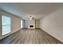 Spacious living room featuring hardwood floors and a brick fireplace at 4000 Tall Pine Dr, Marietta, GA 30062