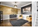 Elegant dining room with dark hardwood floors and stylish furniture at 405 Marvin Ct, Mcdonough, GA 30252