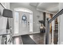 Bright entryway with hardwood floors and an arched door at 405 Marvin Ct, Mcdonough, GA 30252